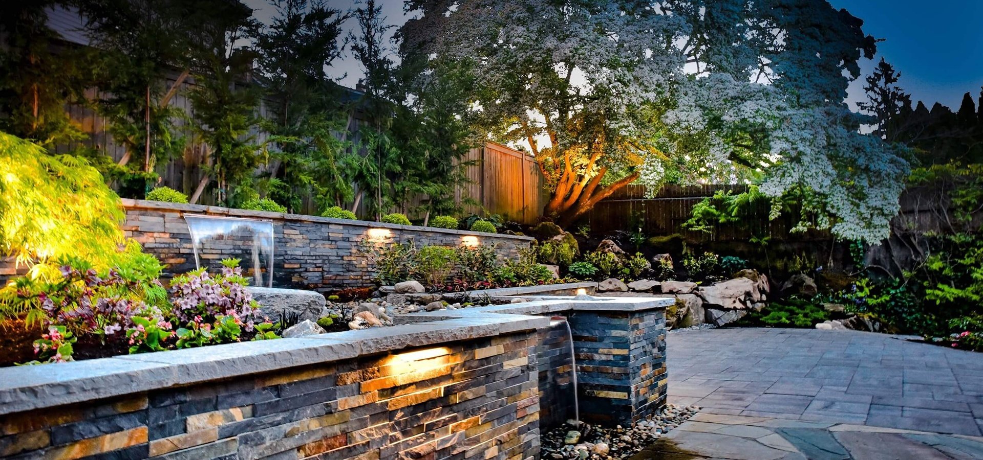 Landscape design, paver patio, retaining wall, outdoor lighting in Seattle WA