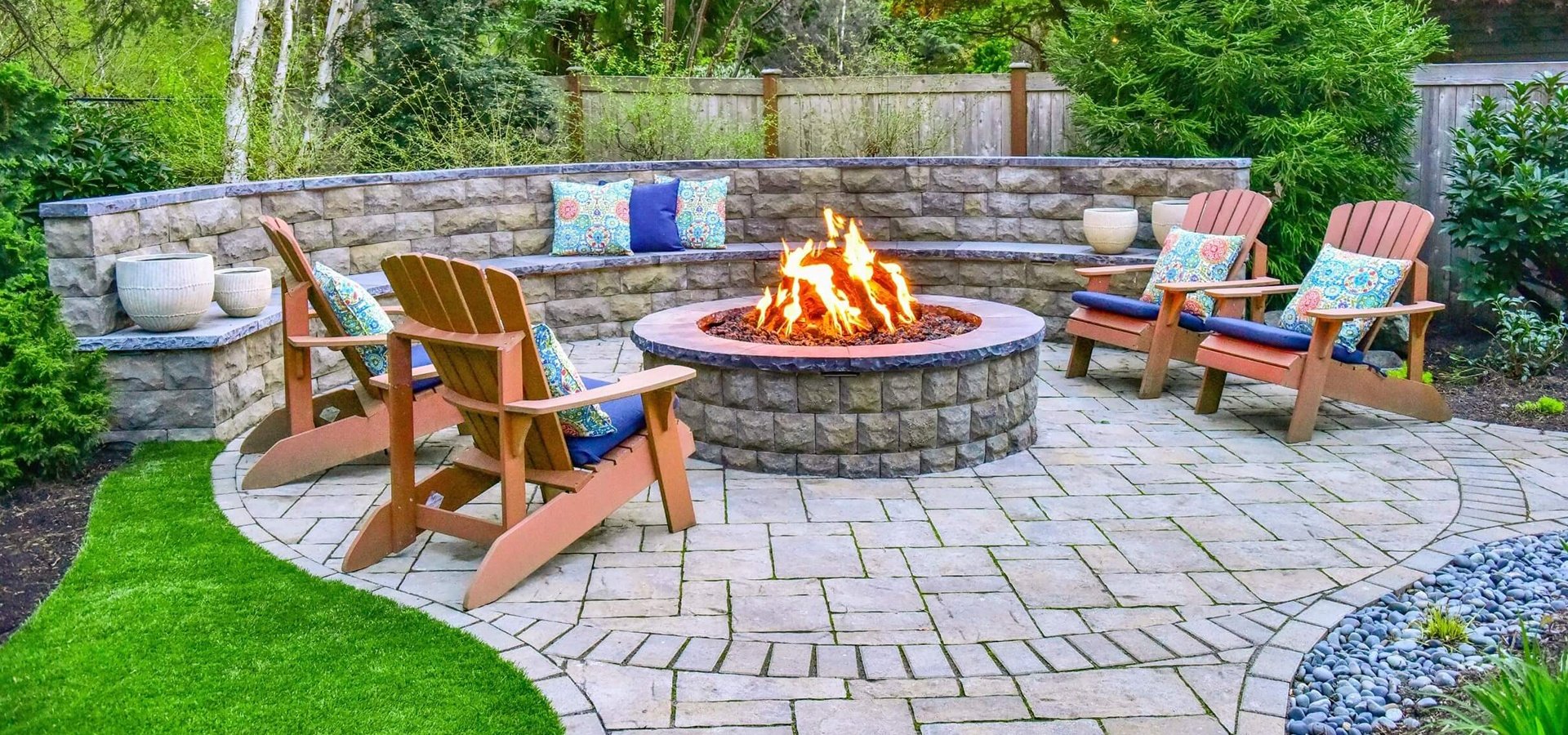 Landscape design with paver patio, fire pit, retaining wall, outdoor lighting in Sammamish, WA