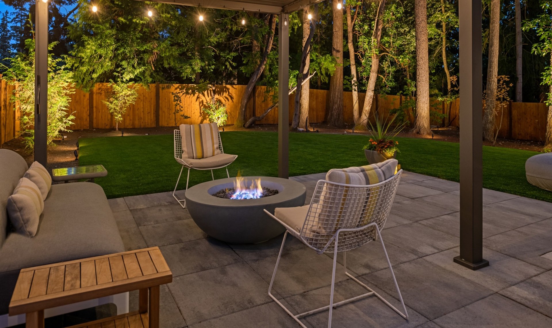 Bellevue, WA landscape design, paver patio, pergola, artificial turf, outdoor kitchen, outdoor lighting