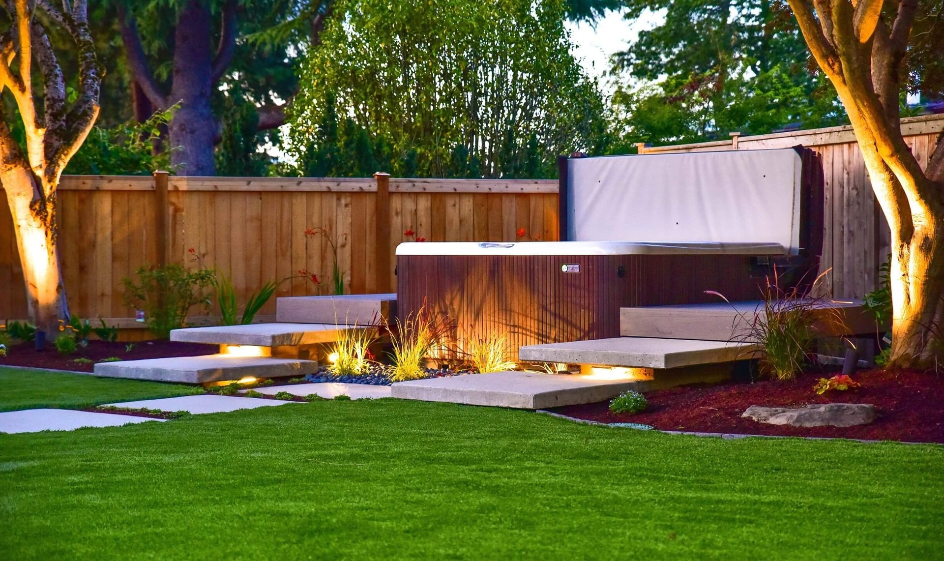 Issaquah, WA landscape design, artificial turf, paverpatio, pergola, outdoor kitchen, outdoor lighting