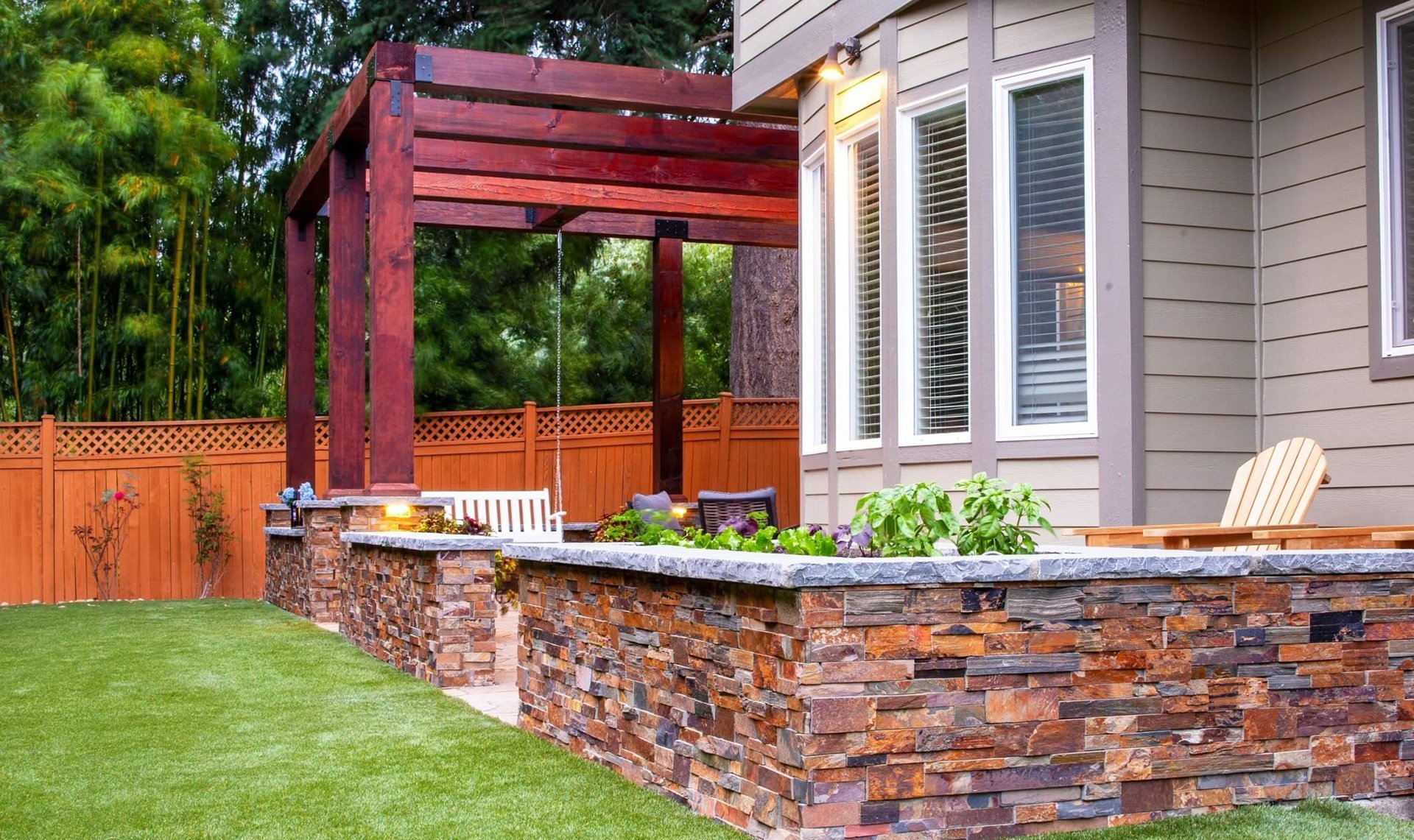 Kirkland, WA landscape design, paver patio, pergola, outdoor kitchen, lighting, artificial turf