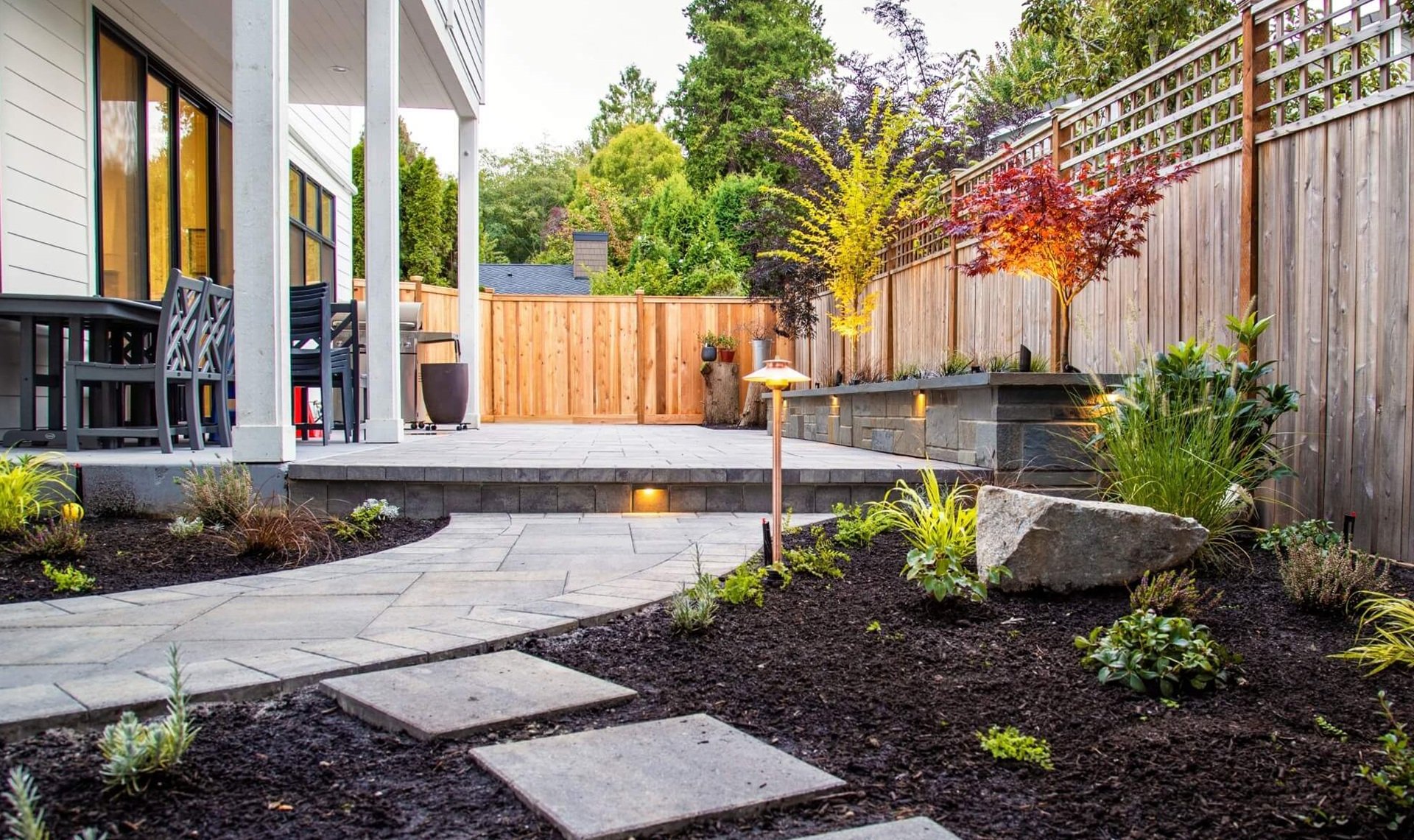 Magnolia, WA landscape design, outdoor kitchen, outdoor lighting, paver patio, pergola, artificial turf