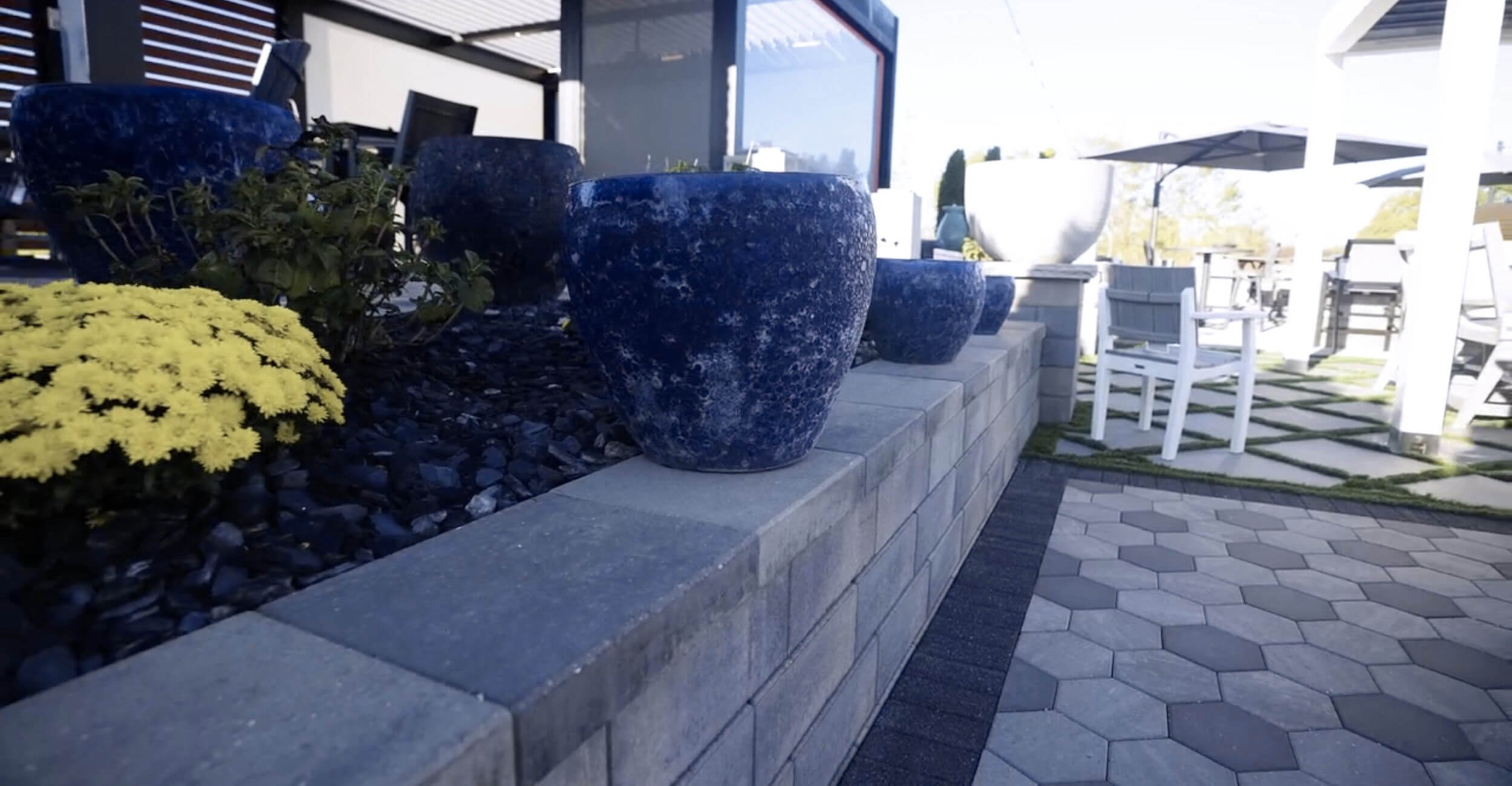 Hardscape material wall showcased at the outdoor living showroom in Troy, Shelby Township, and Rochester Hills, MI with stone and paver options