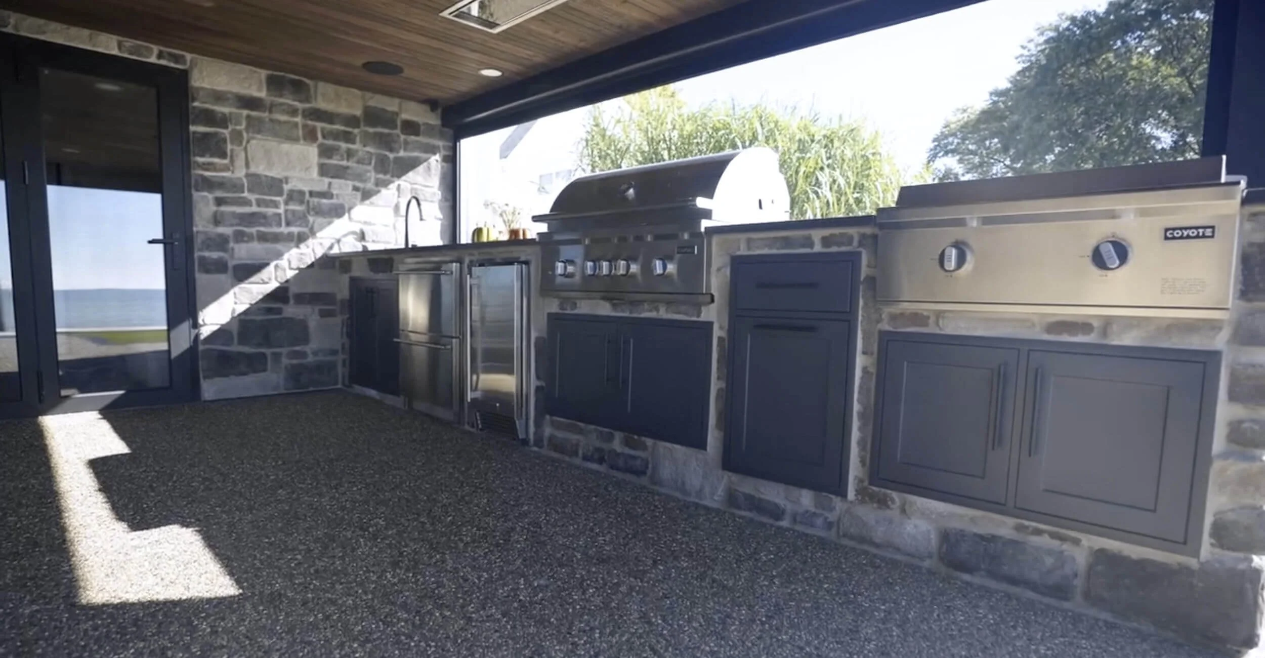 Defined outdoor kitchen backyard oasis design in Troy, Shelby Township, and Rochester Hills, MI