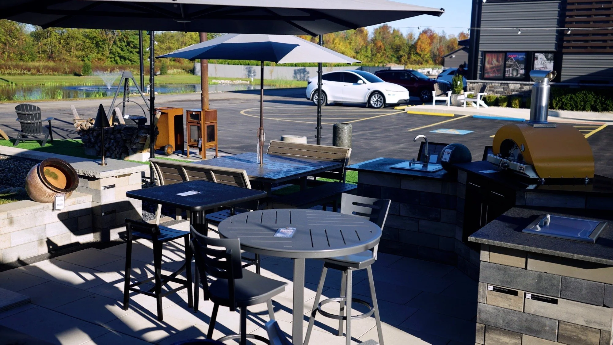 Poolside pavilion bar area with stools and shaded outdoor entertaining space