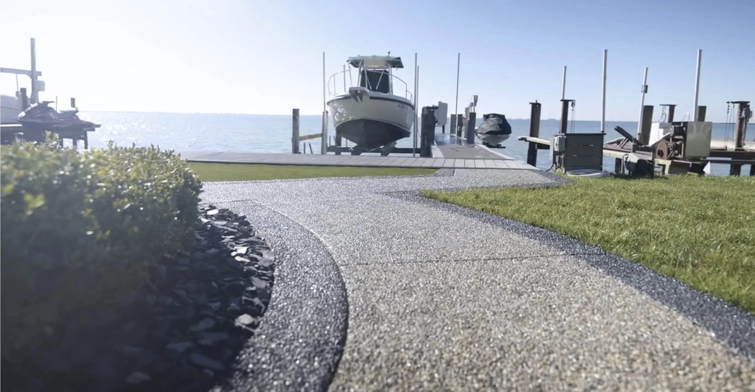 Curved walkway and borders shaping dynamic backyard oasis design in Troy, Shelby Township, and Rochester Hills, MI