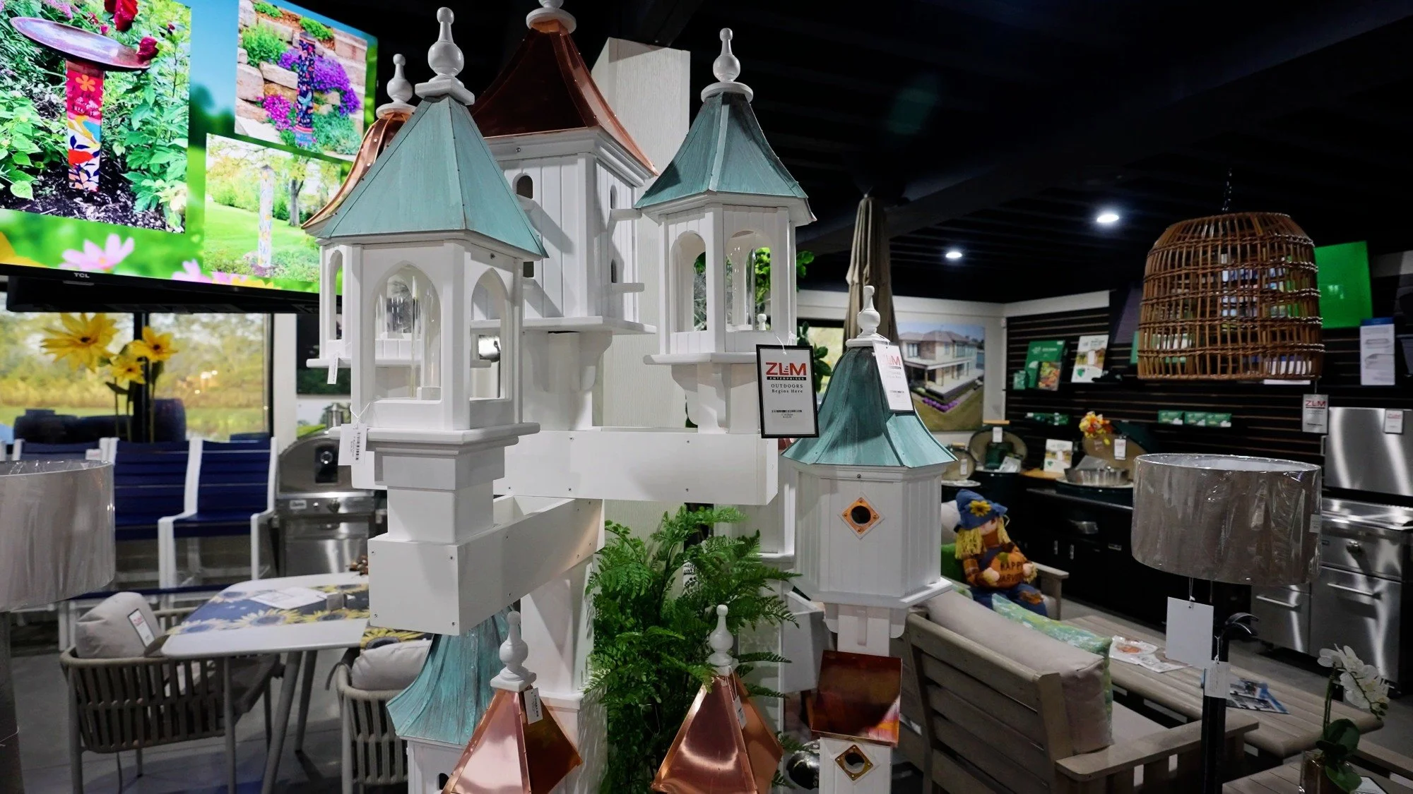 Decorative castle display and garden decor inside the ZLM Outdoor Living showroom