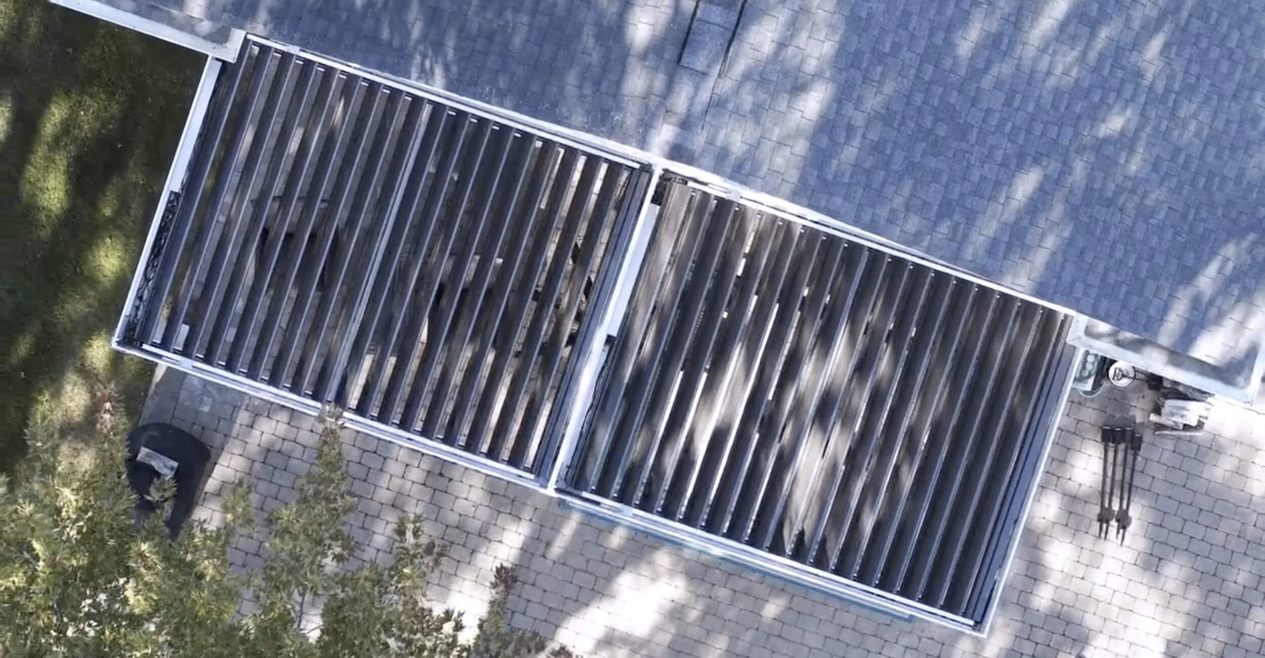 Weather-adaptive backyard showcasing three season outdoor living in Troy, Shelby Township, and Rochester Hills, MI with a motorized R-Blade pergola system