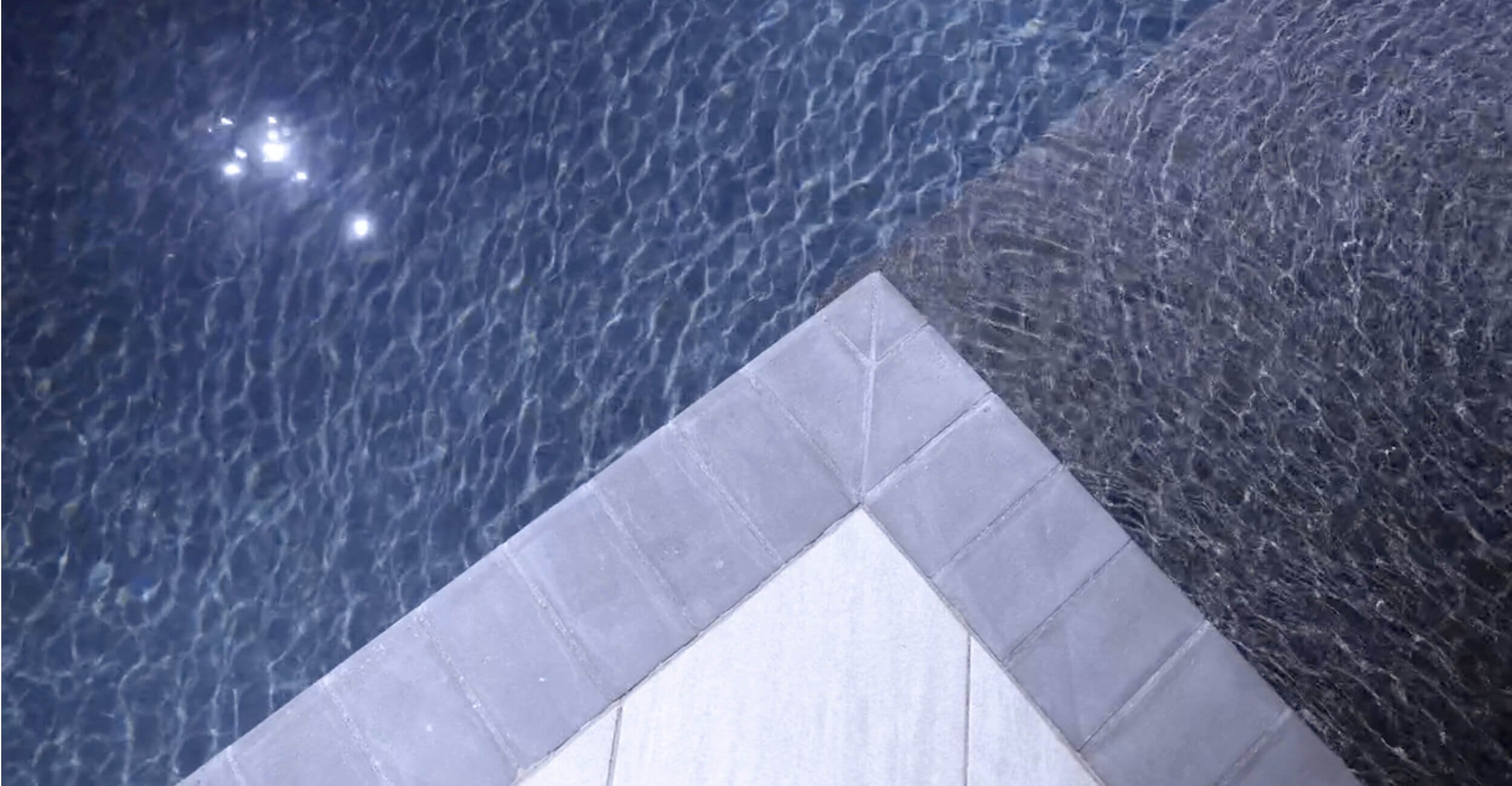 Open-concept backyard retreat featuring tailored custom pool design in Troy, Shelby Township, and Rochester Hills, MI with sun shelf