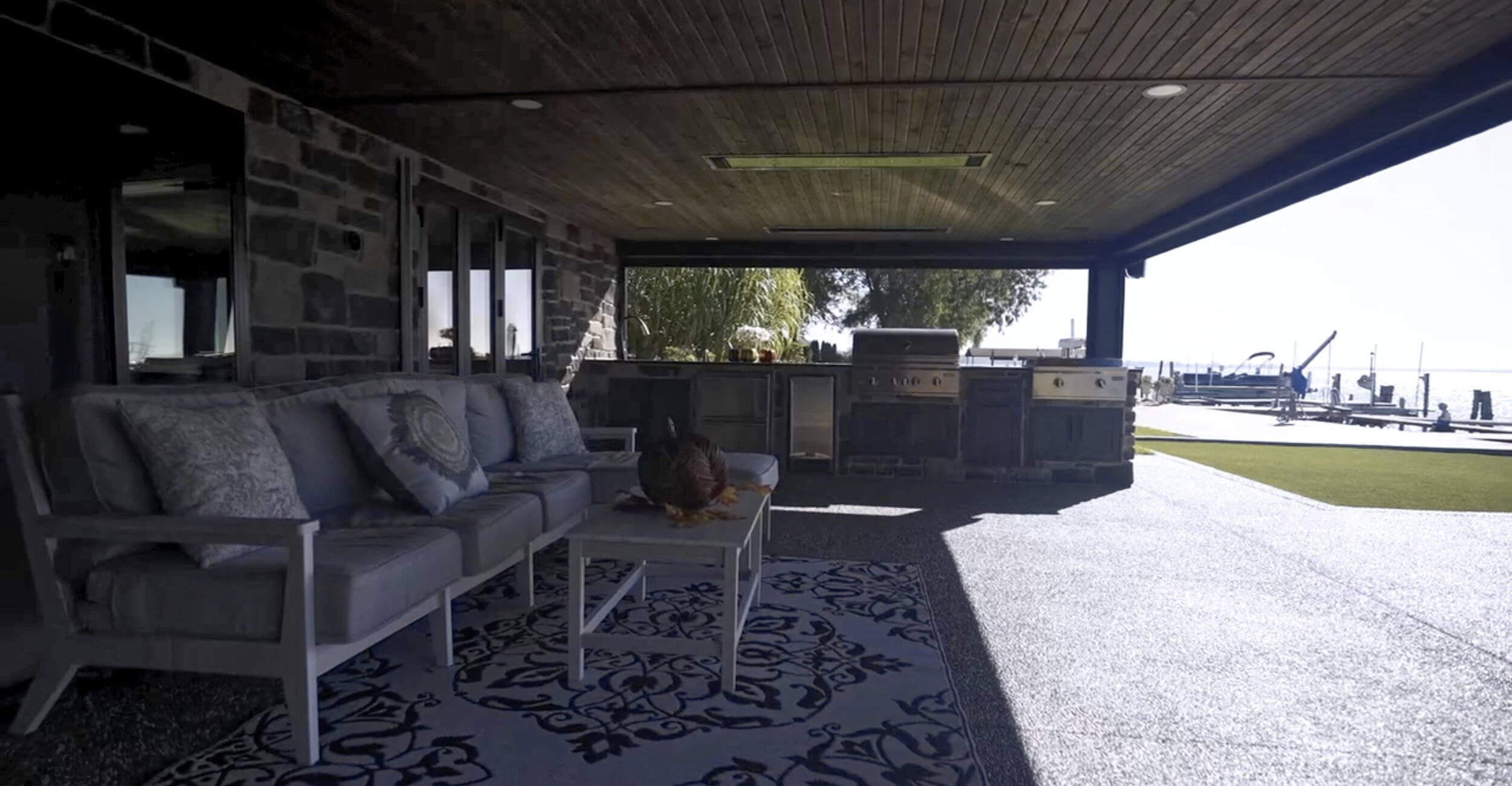 Defined outdoor dining space incorporated into sophisticated backyard oasis design in Troy, Shelby Township, and Rochester Hills, MI