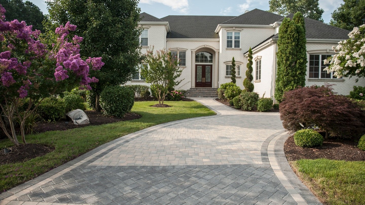 Landscape design in Powhatan County, VA with paver driveway and plantings