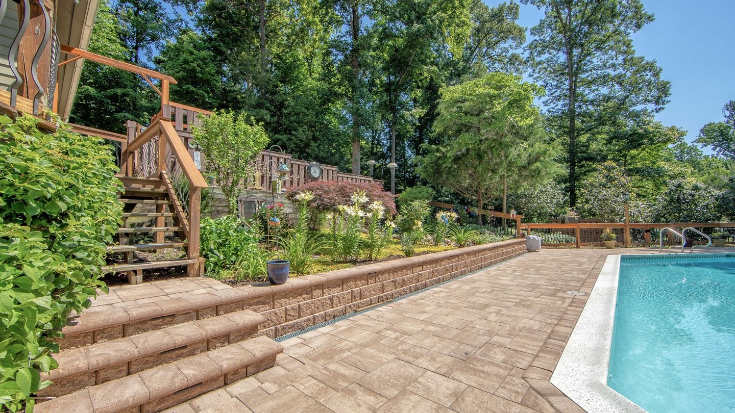 Paver patio with inground pool and retaining wall in Short Pump, VA