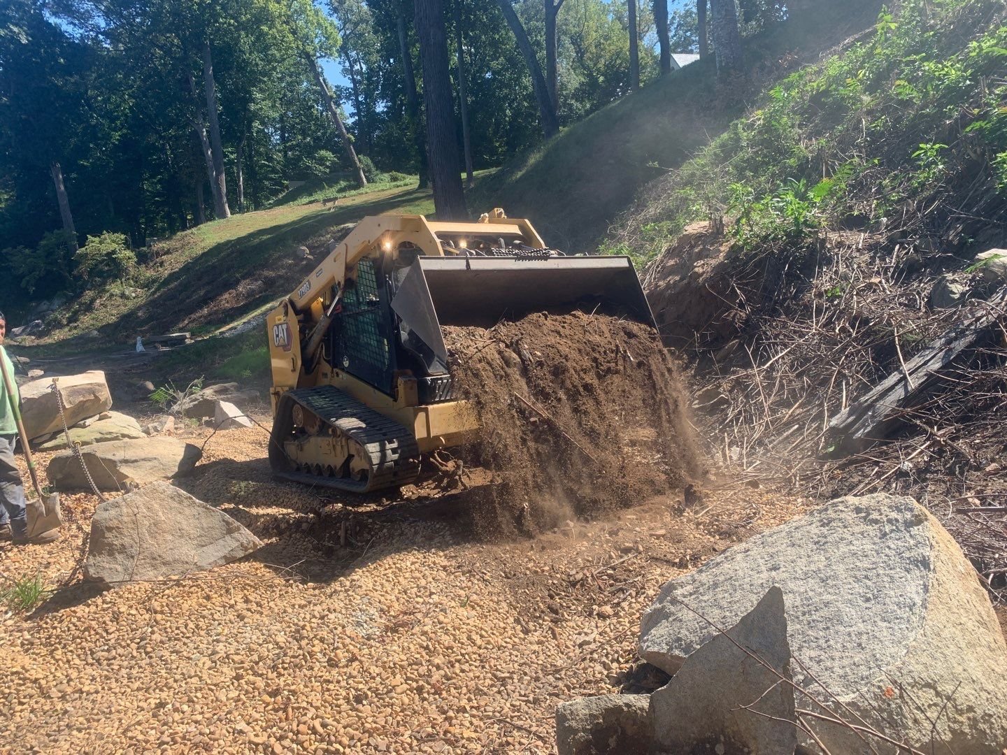 In Progress - Bobcat Clearing Debris.jpg