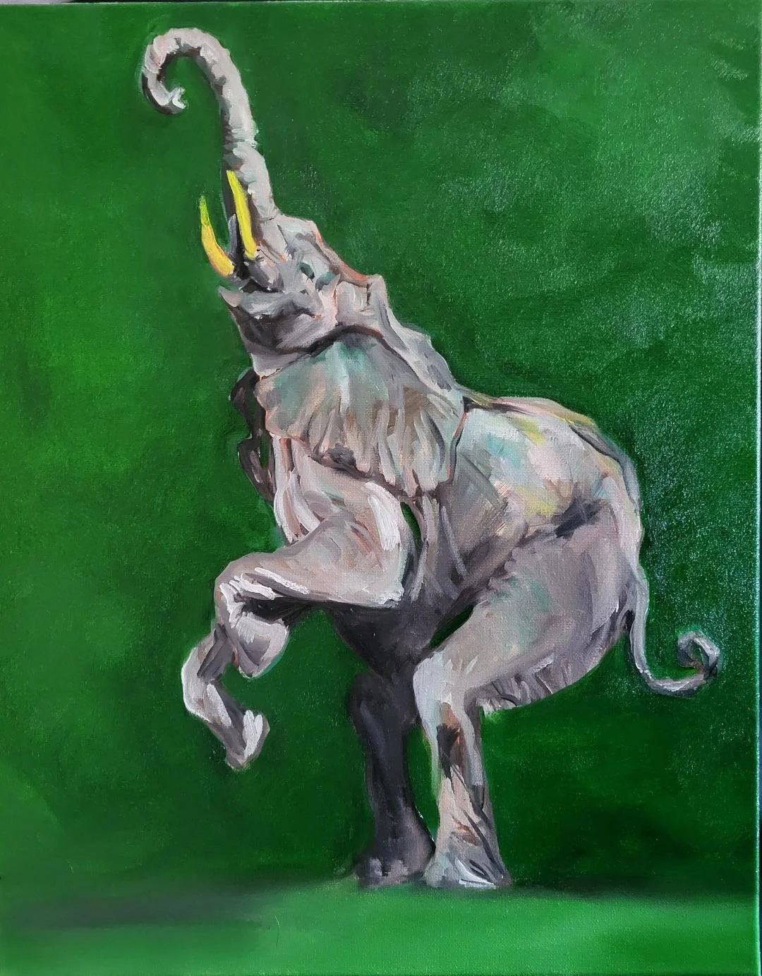 Painting of a stylized elephant with a raised trunk and yellow tusks on a green background.