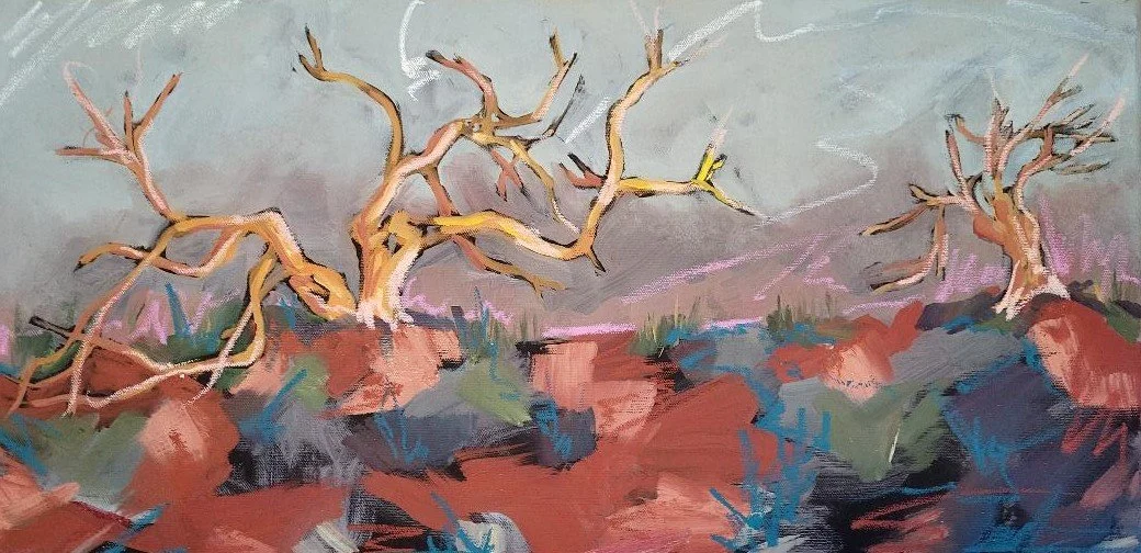 Painted scene of two leafless trees on rocky ground with a cloudy sky in the background.