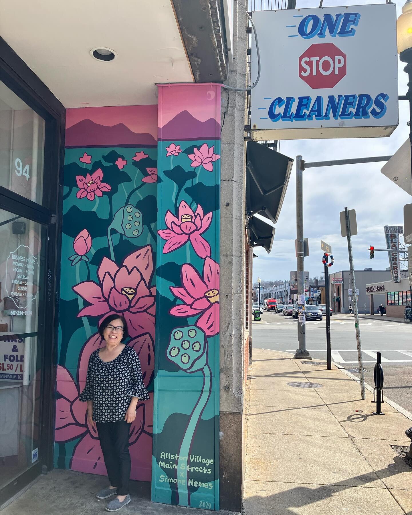 New #MuralsInMotion at One Stop Cleaners on Harvard Ave! @slimbones_nemes did and fantastic job capturing a scene of lotus flowers, which is the national flower of Vietnam, home country of the owner, Julie! Just look how excited she is!