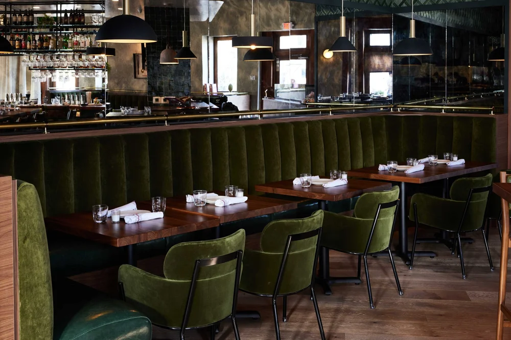 Main dining room with green velvet banquettes at Piatti in Alamo Quarry Market