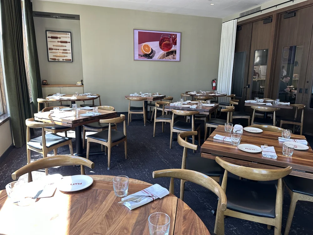 The private Florence Room at Piatti Seattle set for a group dinner