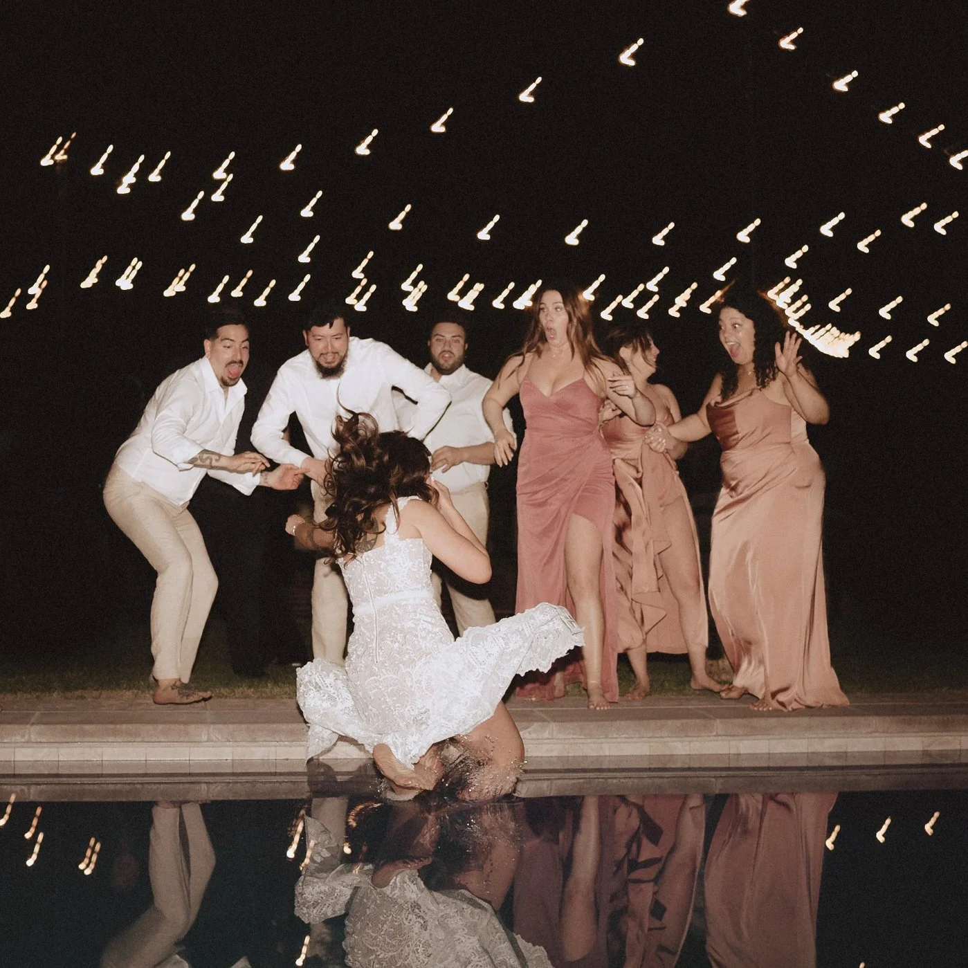 bride Jumping into pool after wedding.JPG