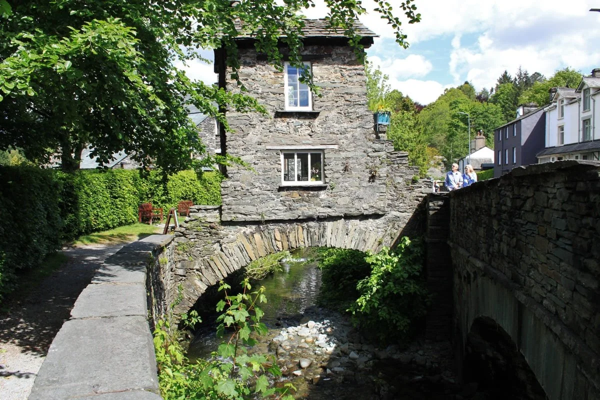 Traditional slate house in Ambleside build over a river