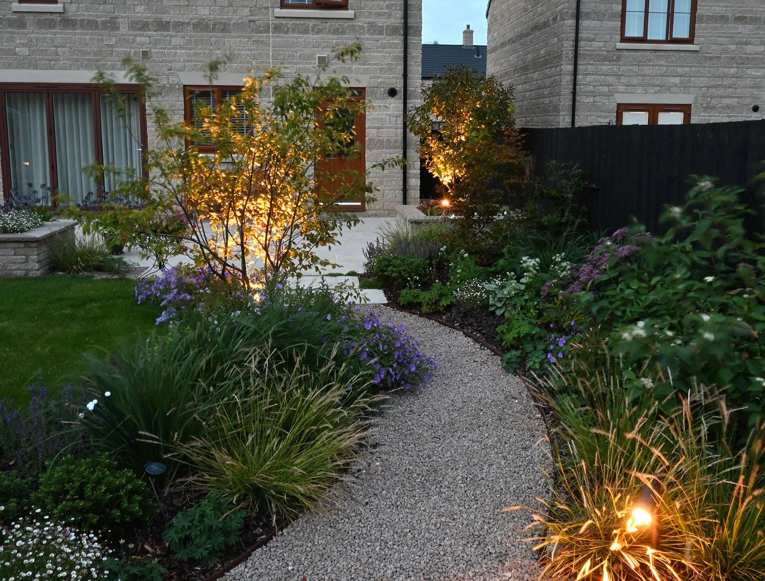 robert-johnson-garden-design-evening-lighting-curved-path.jpg