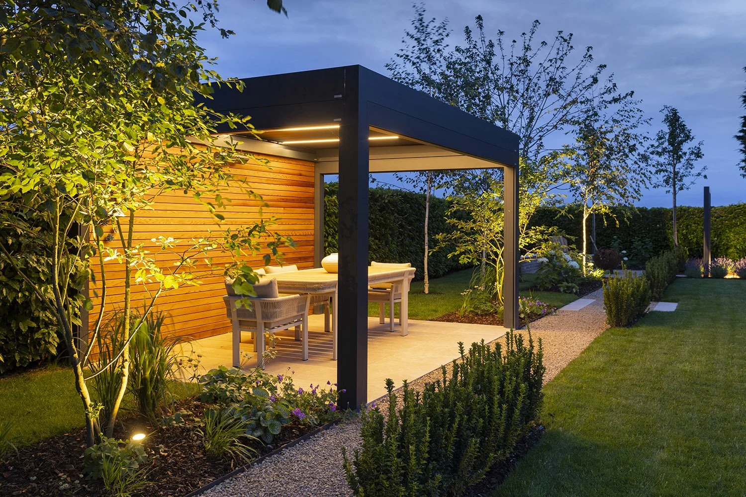 robert-johnson-garden-design-Lincs-aluminium-pergola-multistem-trees-outdoor-lighting-gravel-path.jpg