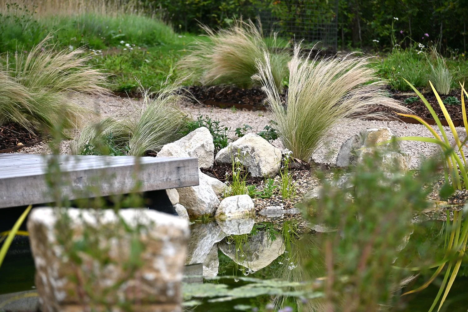 robert-johnson-garden-design-Cambridgeshire-limestone-rocks-pond-jetty.jpg
