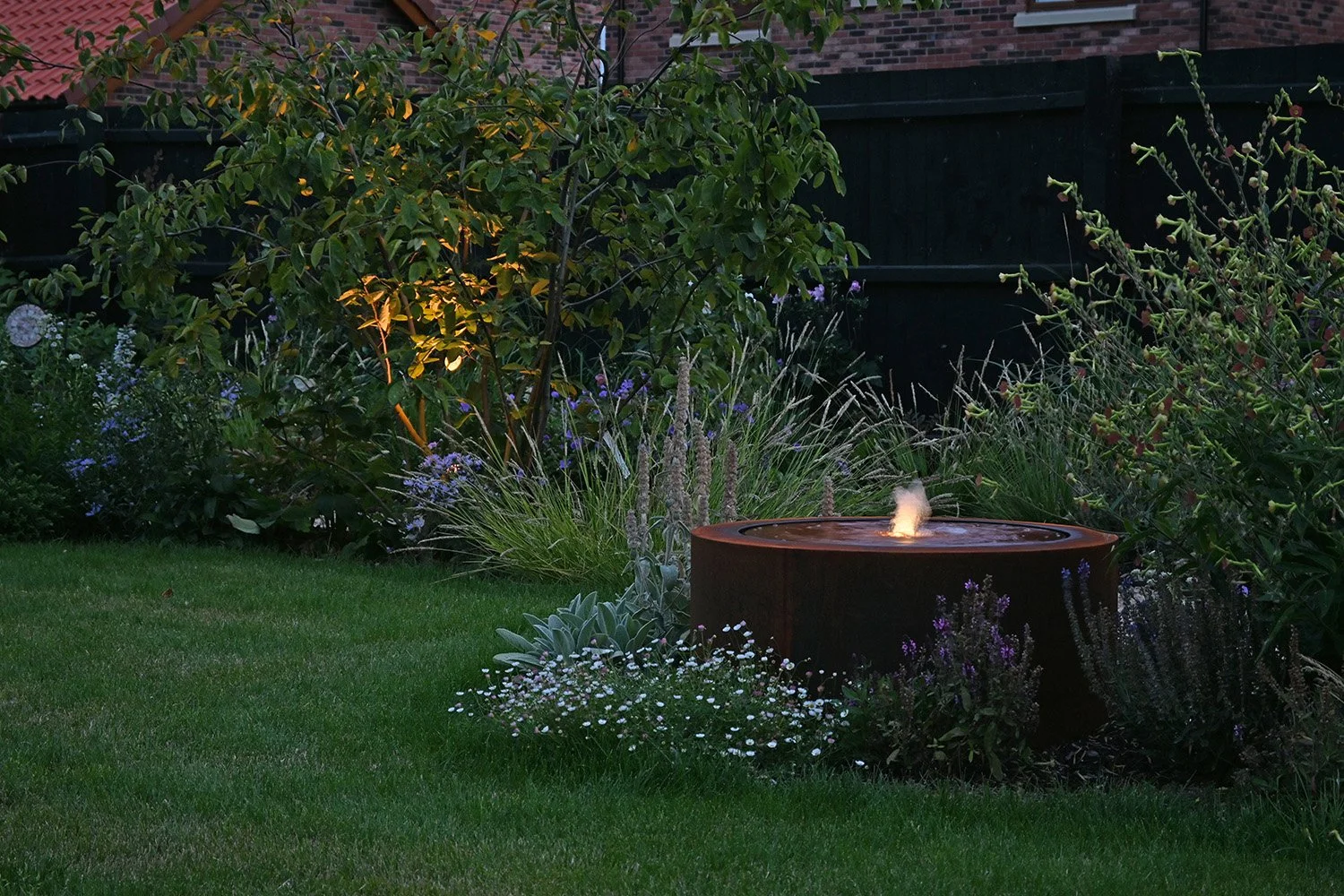 robert-johnson-garden-design-Langtoft-evening-water-feature-illumination.jpg