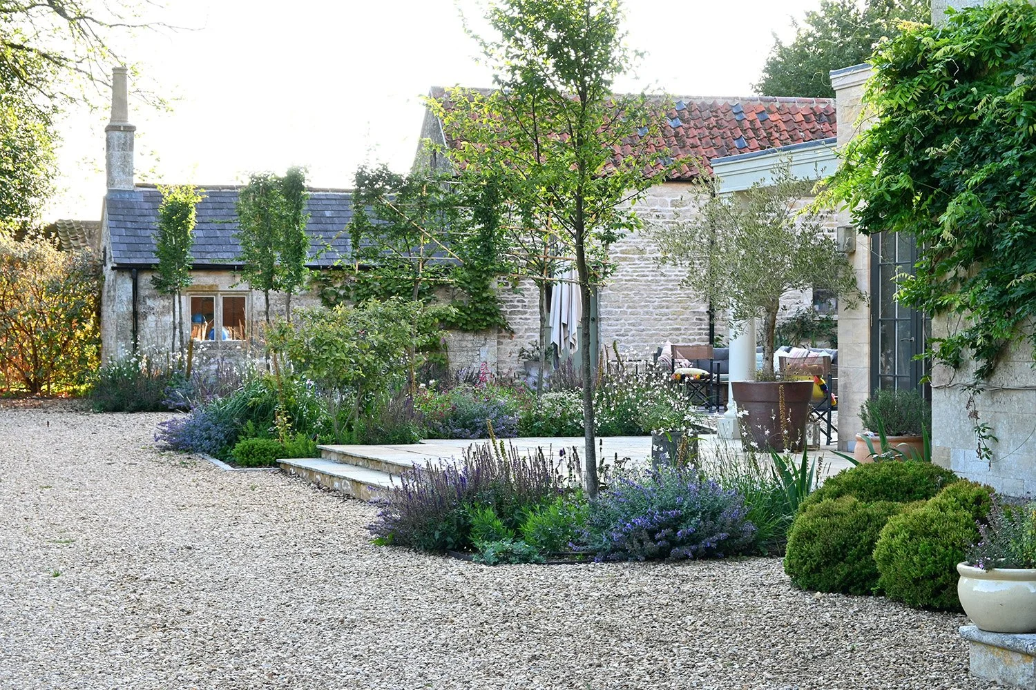 robert-johnson-garden-design-Grantham-gravel-driveway-planted-beds-limestone-steps.jpg