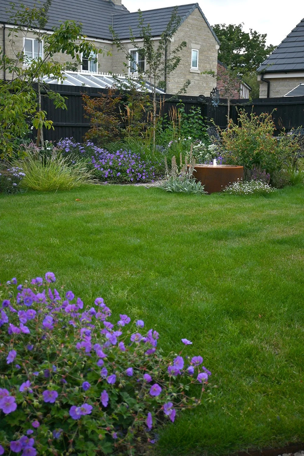robert-johnson-garden-design-Langtoft-lawn-water-feature-soft-planting.jpg