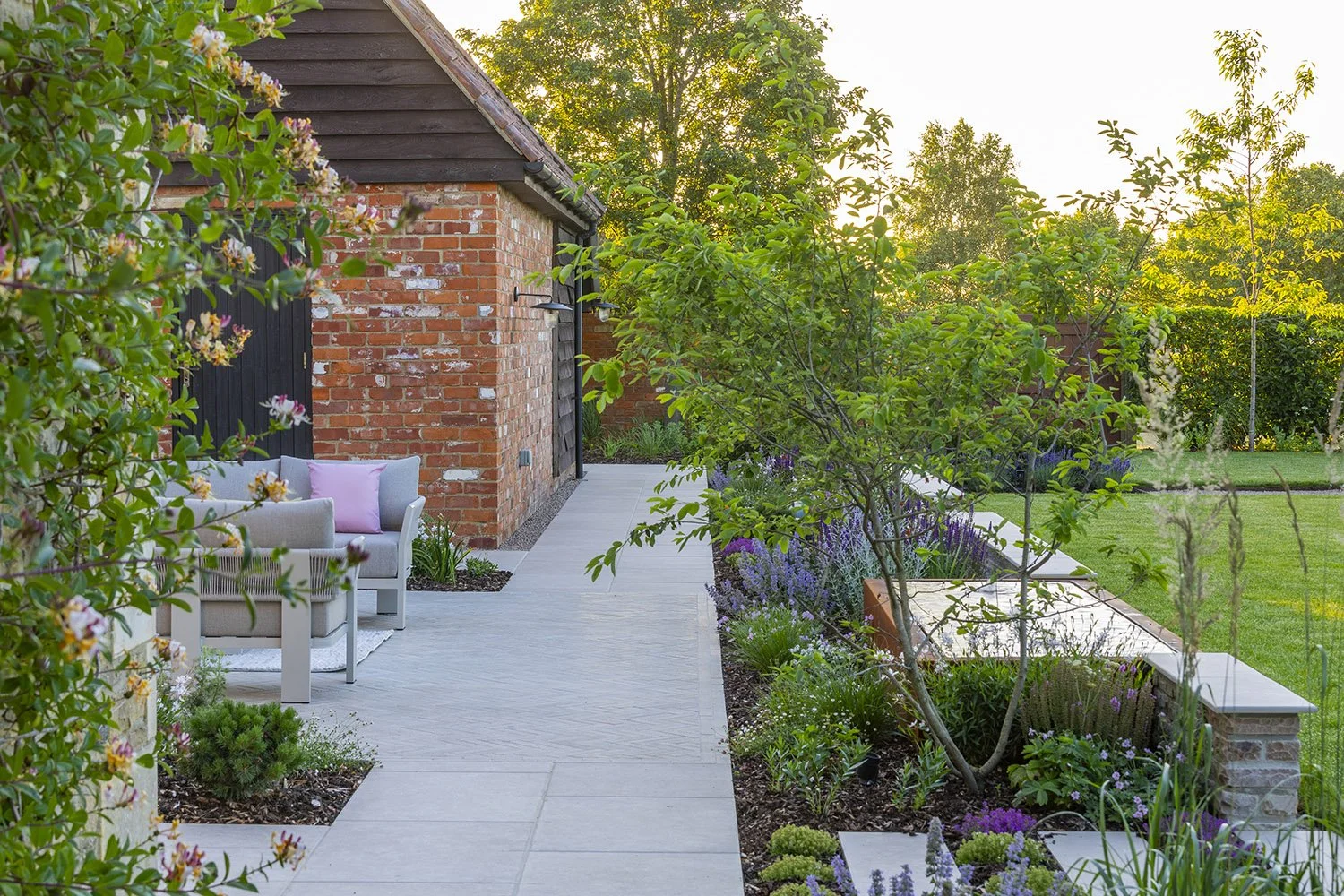 robert-johnson-garden-design-Lincs-porcelain-paving-planting-brick-barn.jpg