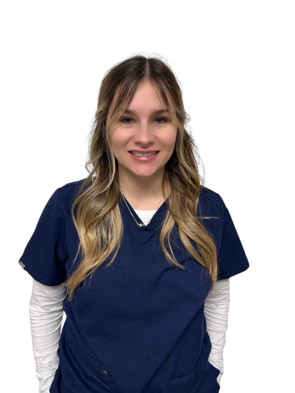 A young woman with long blonde hair in a navy blue medical uniform, smiling at the camera.