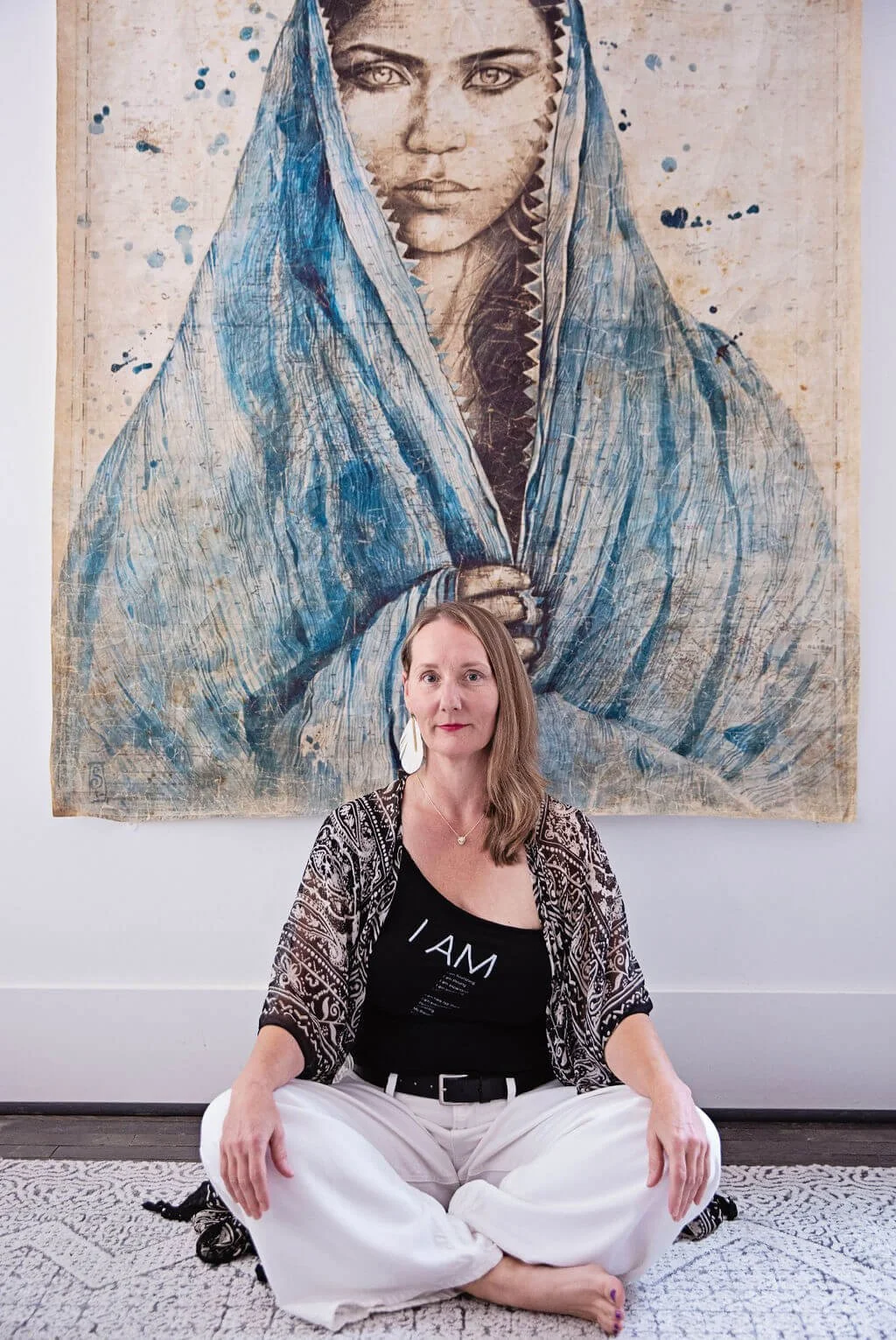 Woman sitting on the floor as prayer.