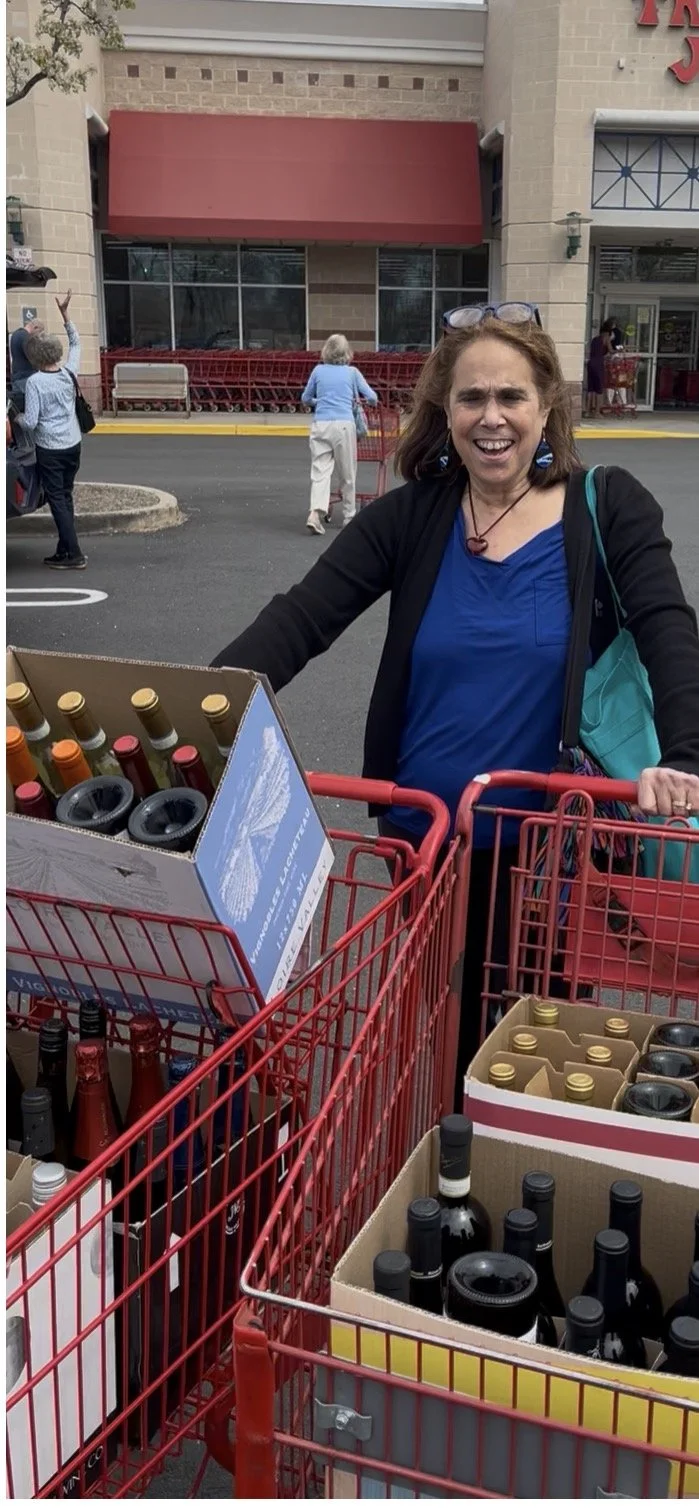 Ellen Fischer showing shopping carts with Trader Joe's wines