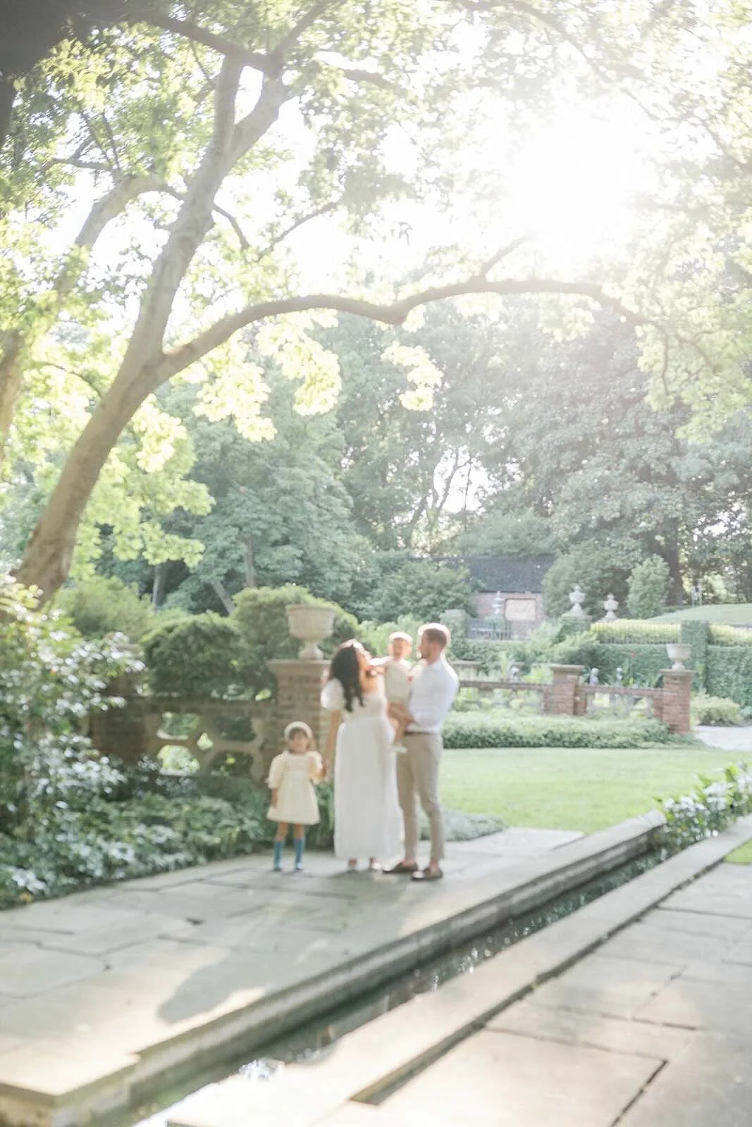 Family outside in the sunlight - Raleigh Newborn Photographer