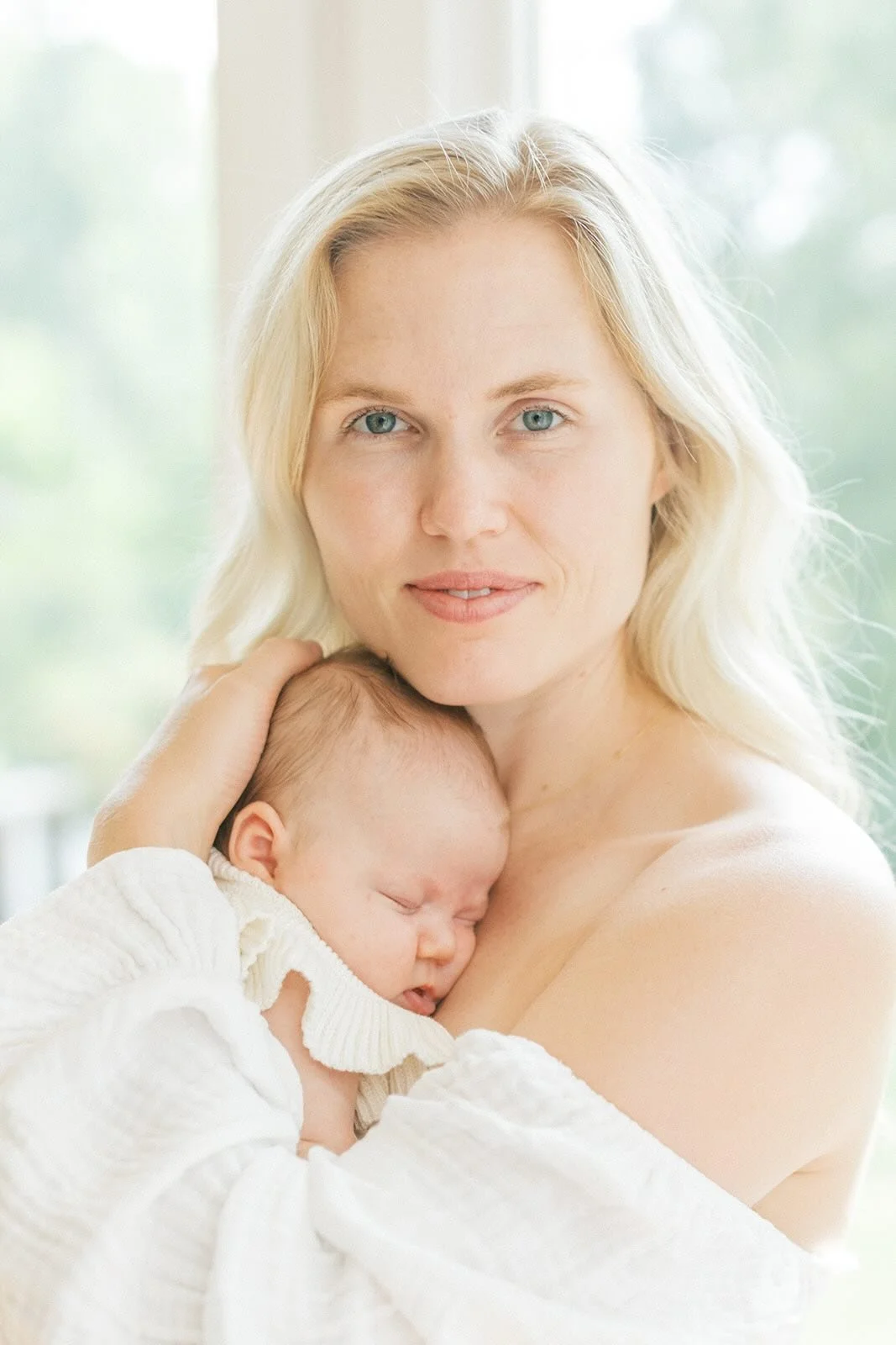 Mother holding baby - Raleigh Newborn Photographer