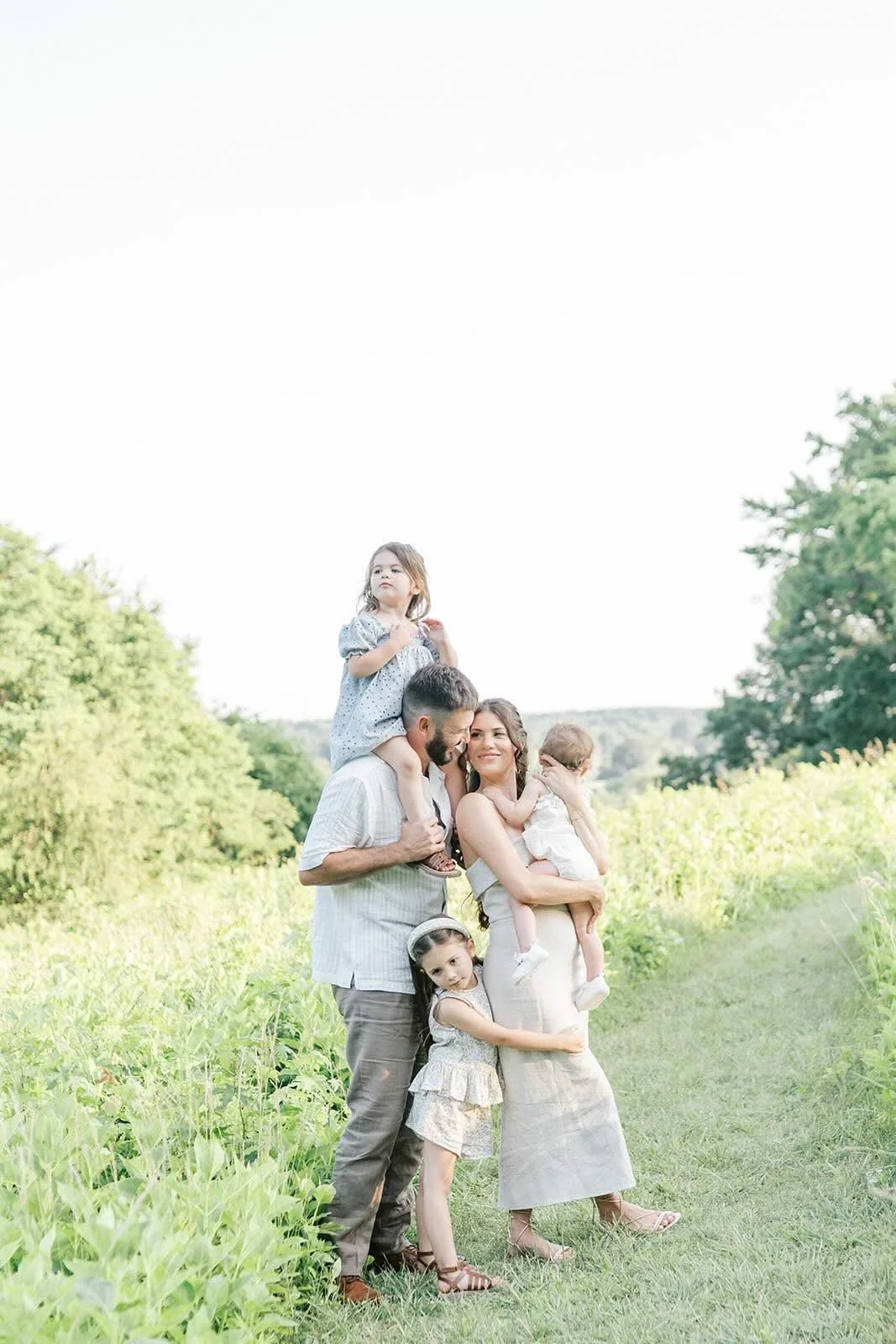 Family outside in a field - Raleigh Newborn Photographer