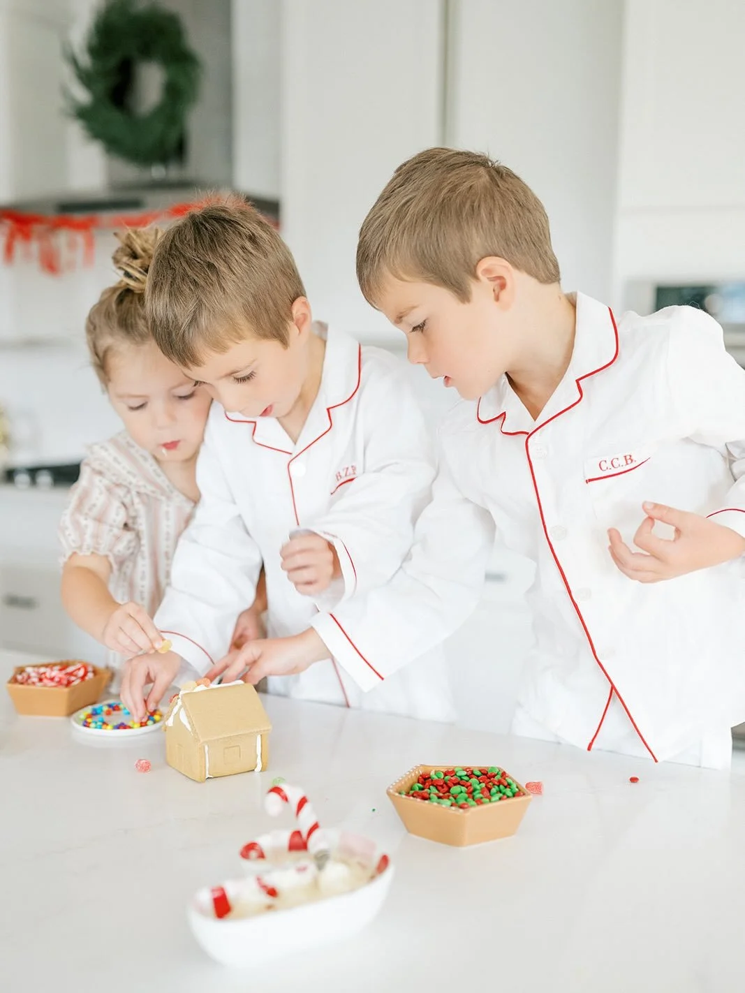 Messy, a little chaotic, and definitely leads to a sugar rush, but decorating gingerbread houses is one of my favorite holiday traditions! 

These are the simple, at-home moments I know we&rsquo;ll treasure most&hellip; and it photographs pretty swee