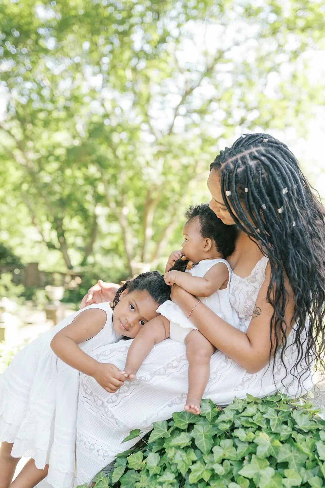 Mom getting hugs outside - Raleigh Newborn Photographer