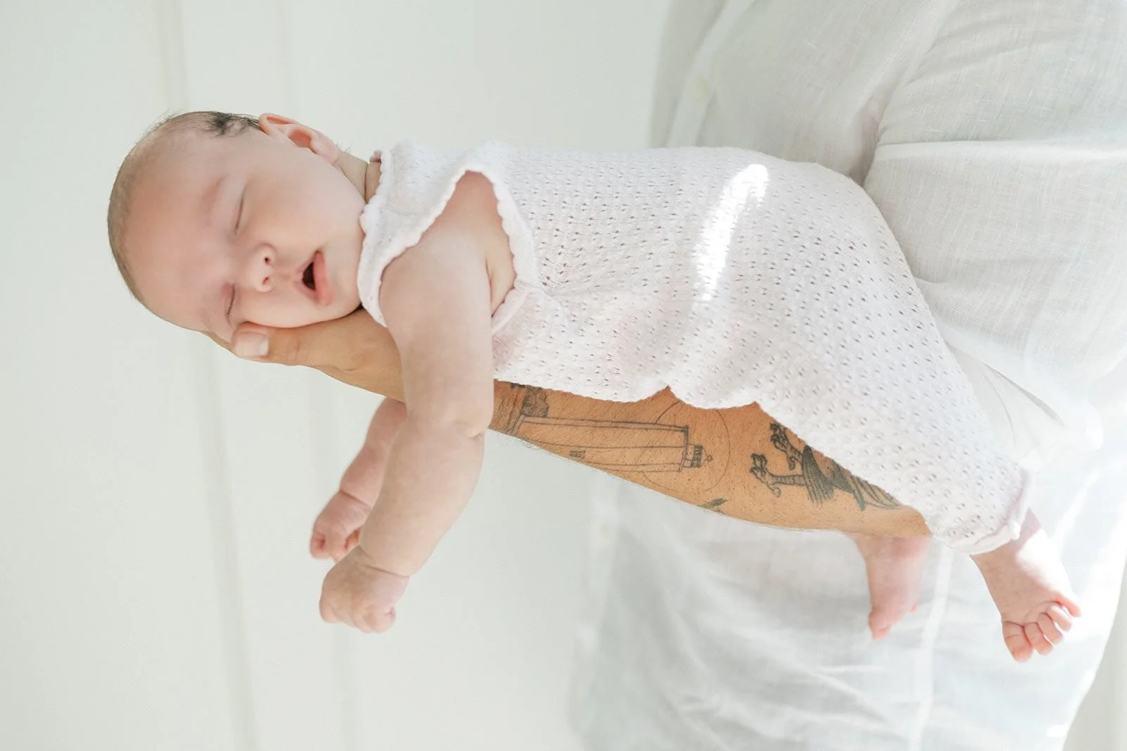 Dad holding sleeping baby - Raleigh Newborn Photographer