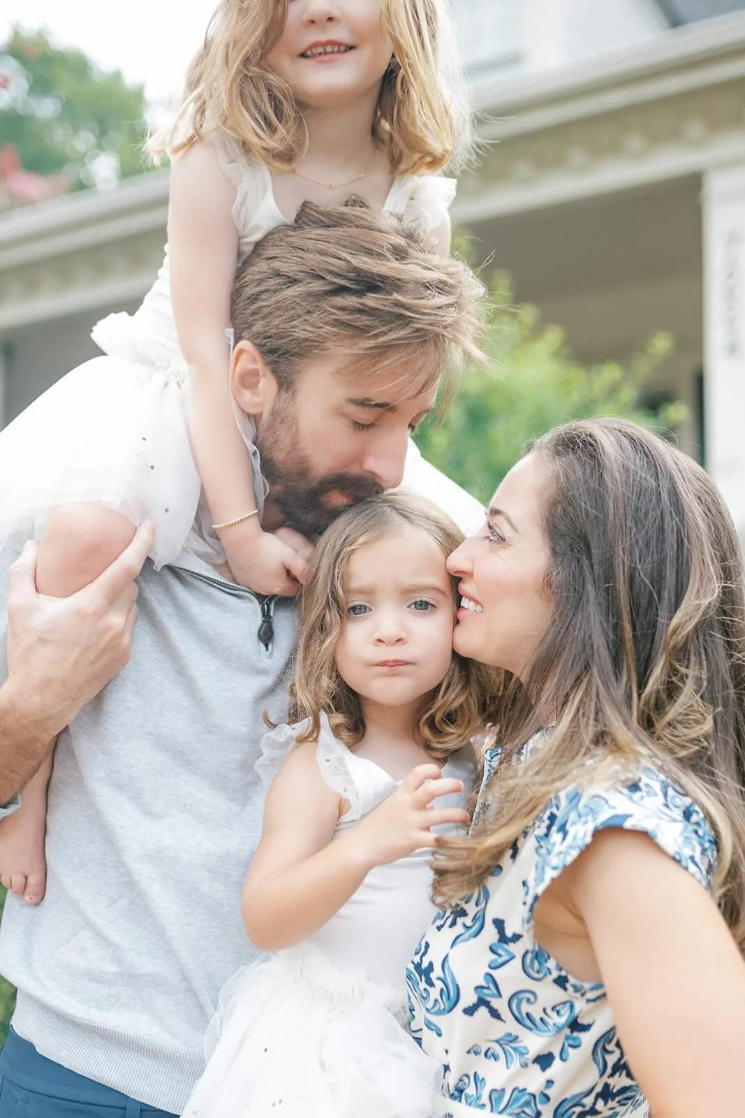 Family hugs outside in the natural light - Raleigh Newborn Photographer