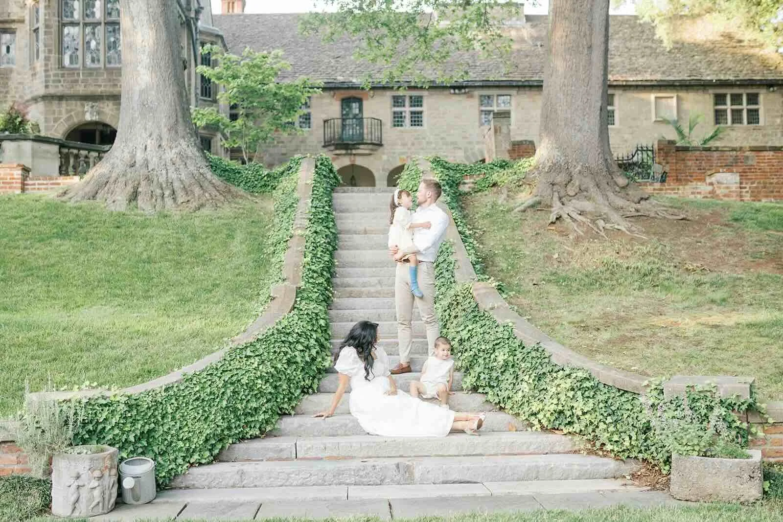 Family on the steps outside in the natural light - Raleigh Newborn Photographer