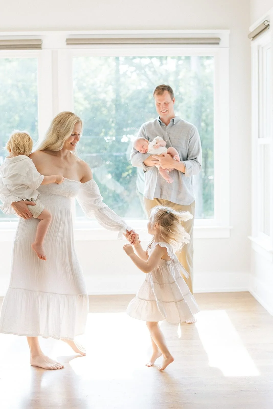 Family dancing in the natural light - Raleigh Newborn Photographer