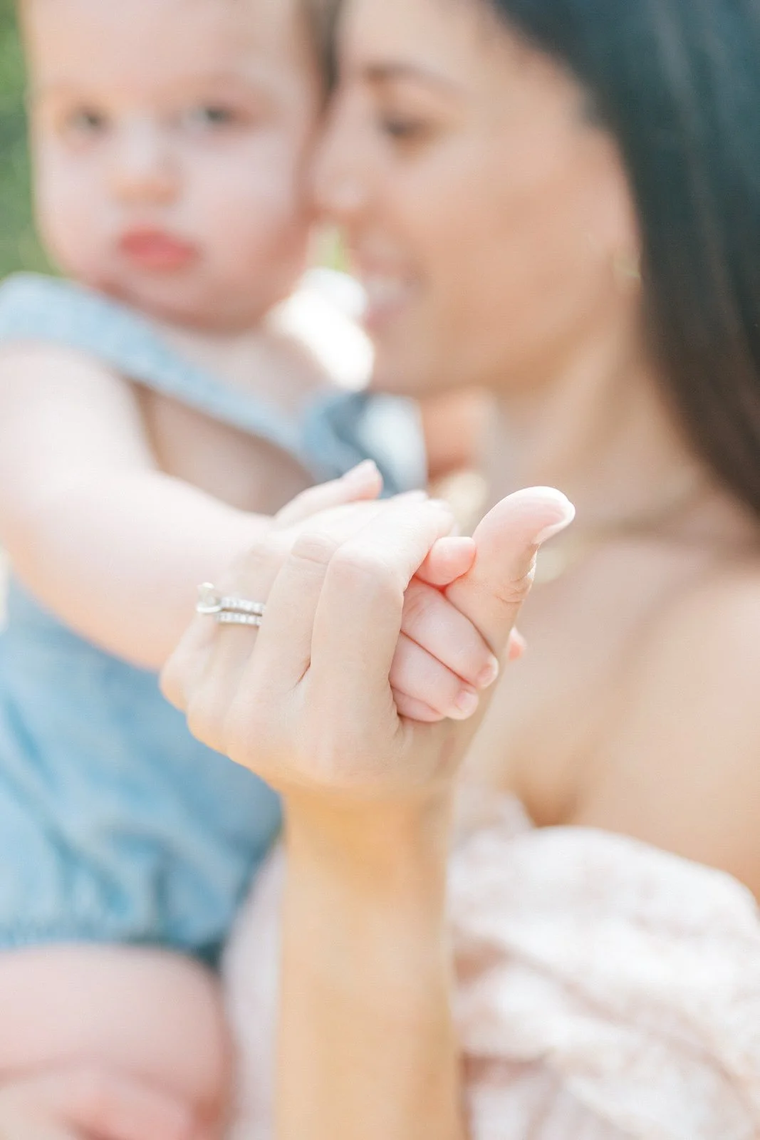 Mom holding sons hand - Raleigh Newborn Photographer