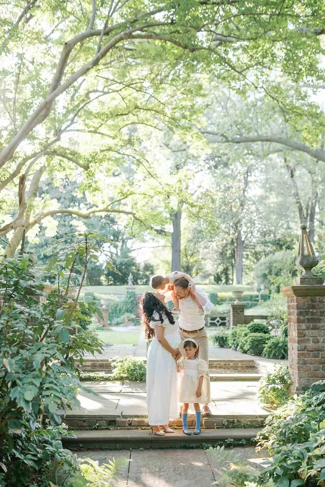 Family outside in the natural sunlight - Raleigh Newborn Photographer