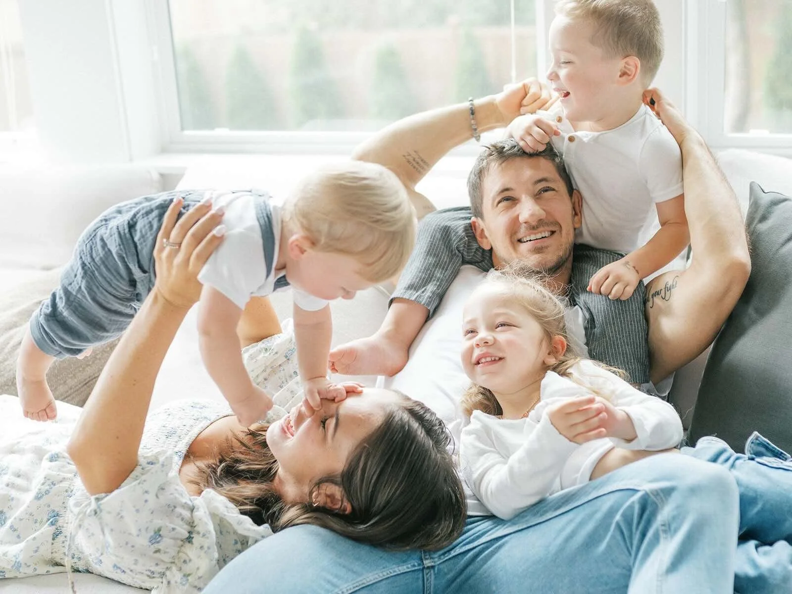 Family cuddles on the couch - Raleigh Newborn Photographer