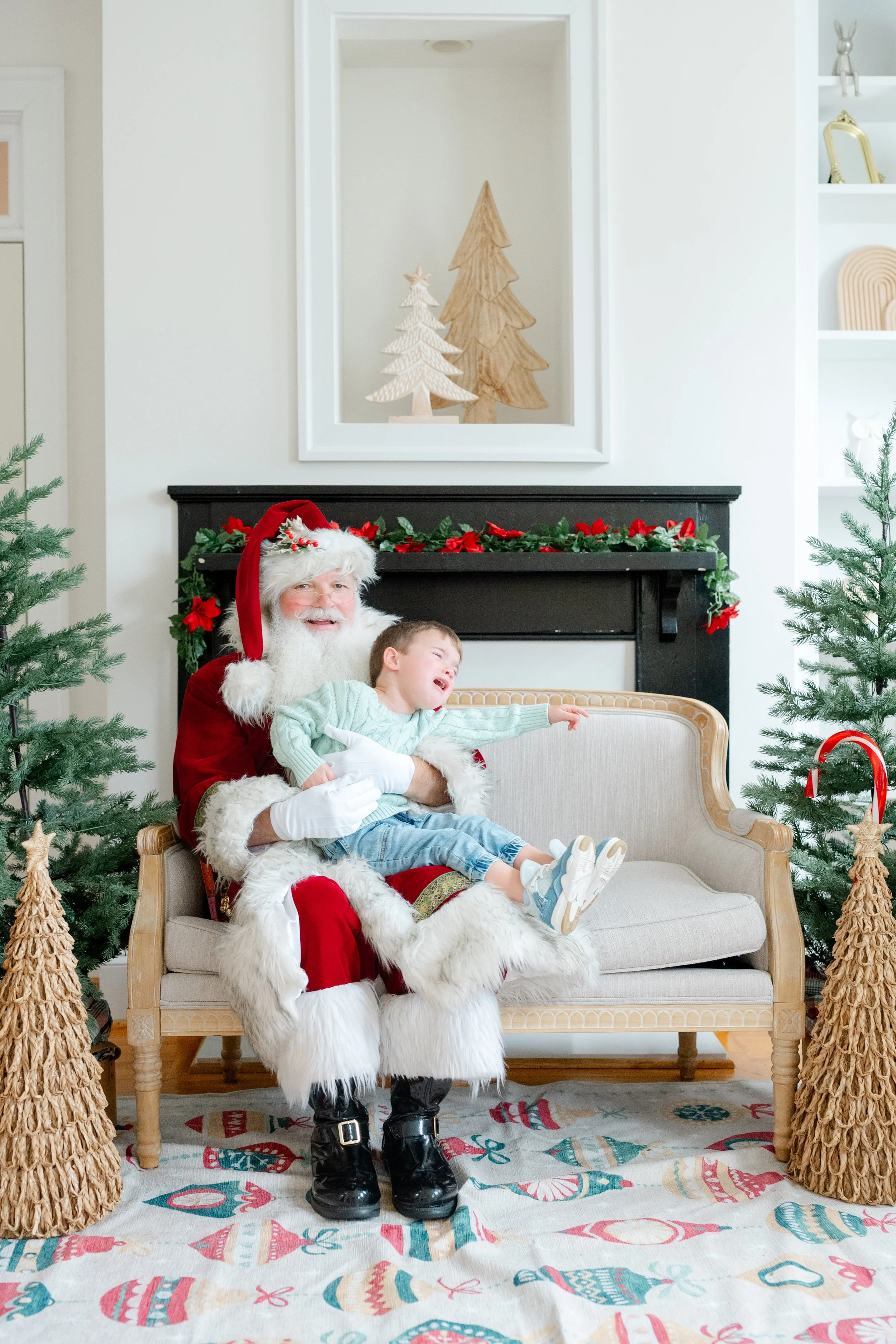 Bot sitting on Santa's lap during his Santa Experience Photos in Raleigh, NC by Kelly Bullock Photography.