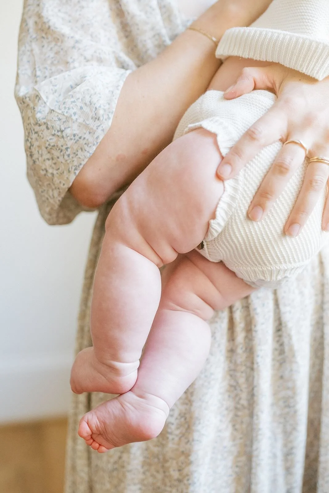 Mom holding baby focusing on her legs and toes - Raleigh Newborn Photographer