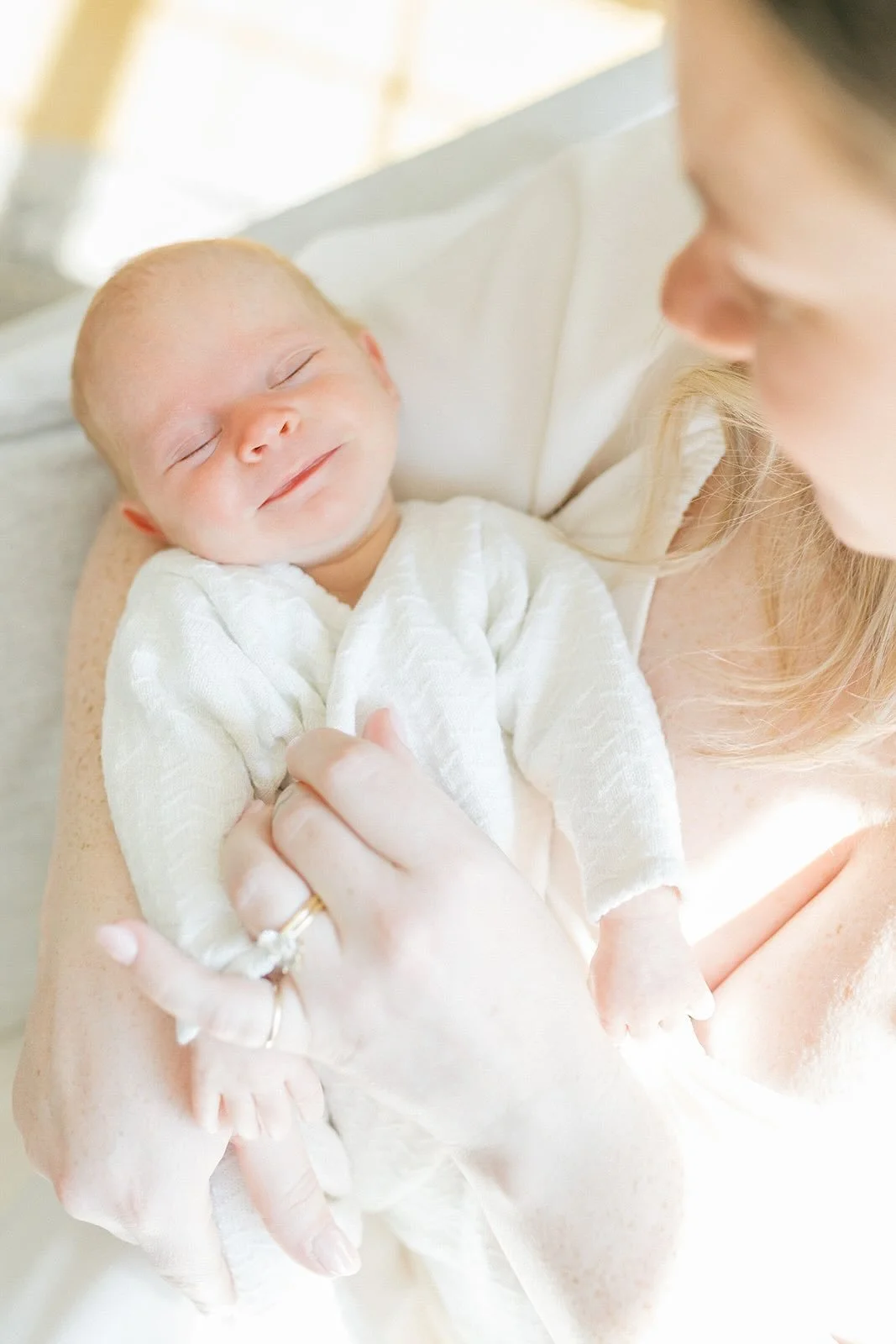 Mother holding smiling baby - Raleigh Newborn Photographer