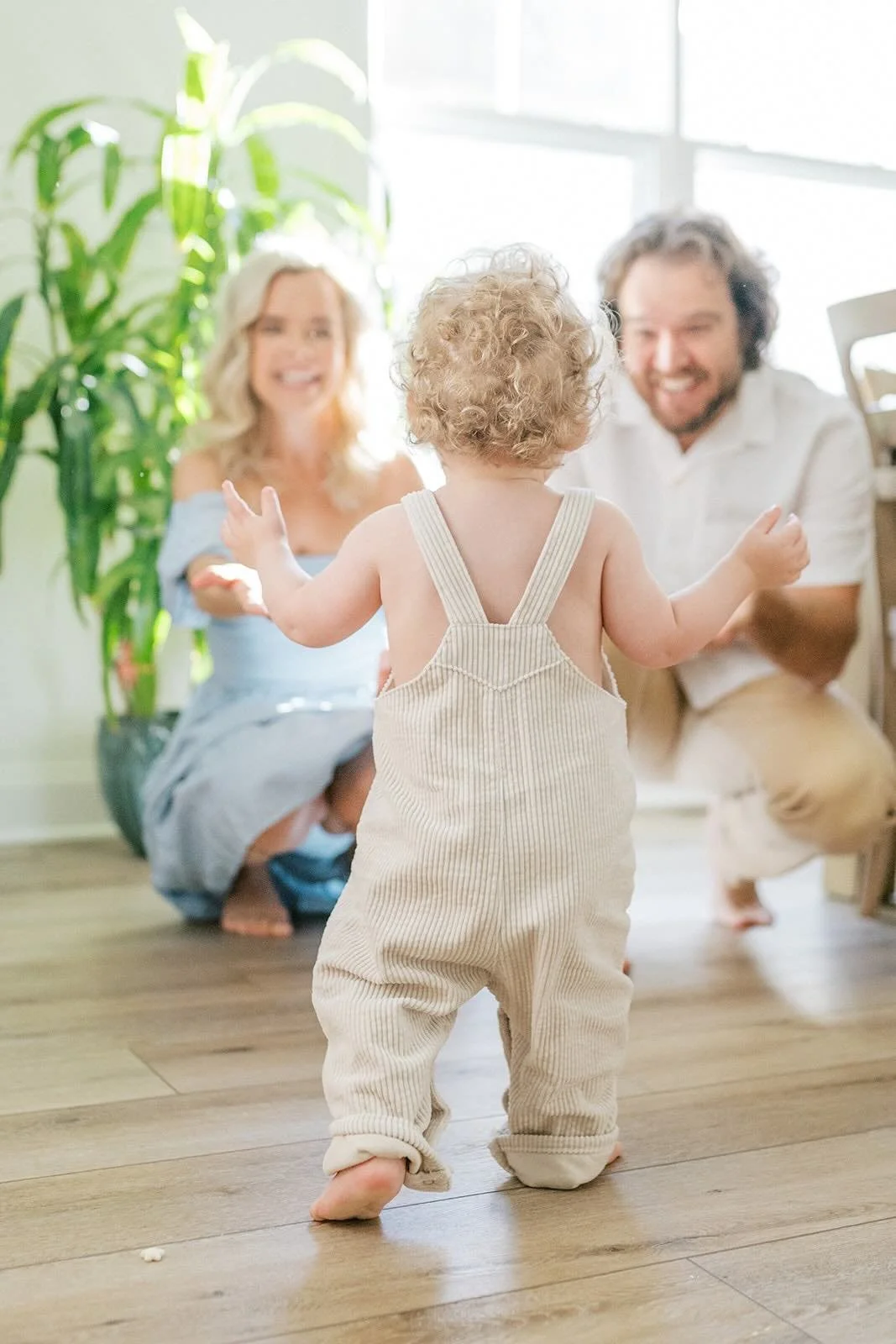 Son walking towards mother and father - Raleigh Newborn Photographer